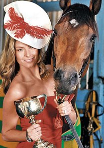 Australian model Jennifer Hawkins posing with the cup